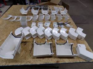 lot 198 image: Genova Rain Gutter Parts, White Hangers  Ends  Couplers  Tees  Elbows