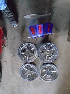 Qty of 4 SS golf cart hub caps. As shown.
