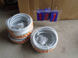 Qty of 5 4m renishaw braided stainless plastic lined conduit. As shown.