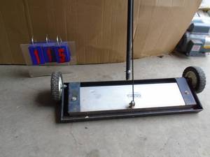 Magnetic floor sweeper with lever to dump load. 24 wide. As shown.