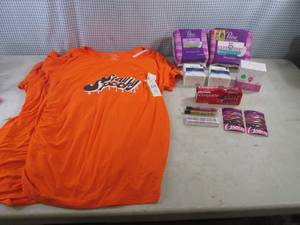 lot 87 image: (CSB) 3 Stay Spooky Maternity Shirts 2 Large 1 Small, Ladies Liners and Pads, Ivory Bar Soap, Tooth Paste, Makeup, Hair Clips Etc