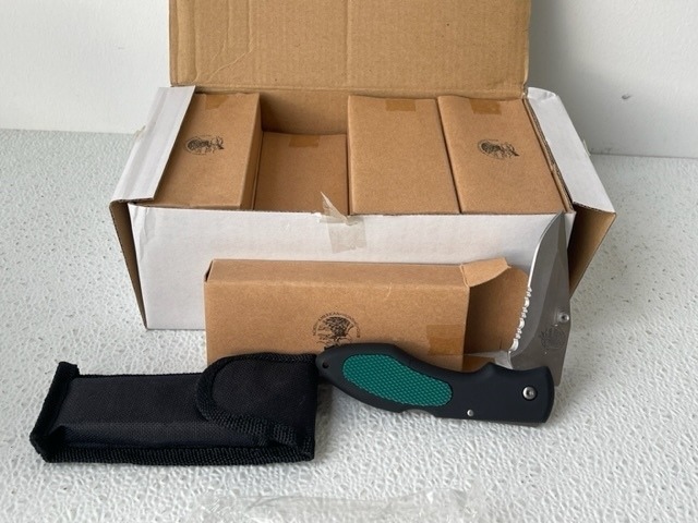 lot 24 image: North American Hunting Club Pocket Knives