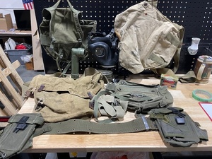 lot 48 image: Vintage Military Gear, Gas Mask, Flashlight