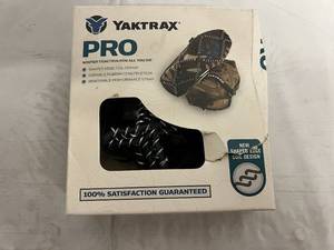 lot 75 image: Yaktrax Pro Traction Device - Size Medium (Size Conversion in Pictures)