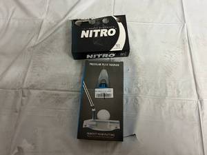 lot 89 image: 8 Nitro Golf Balls and Pressure Putt Trainer
