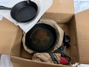 lot 168 image: MegaChef 9-Pc. Pre-Seasoned Cast Iron Skillet Set with Lids and Red Silicone Holder