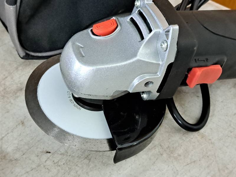 lot 130 image: Drill Master 4-12 Angle Grinder 69645 with Handle, Wrench and Tool Bag