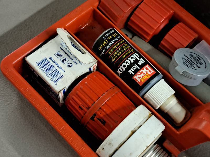 lot 332 image: 19-12 Plastic Tool Box with Gas Leak Detector, Flaring Tool, Solder, Silicone and more