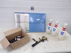 lot 40 image: Screw in Tree Steps with Driver, 3 Bowling pins and Shower Rod