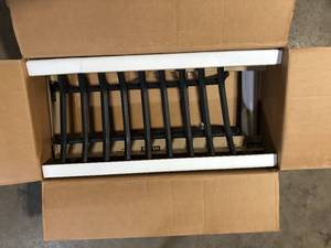 lot 32 image: ACHLA DESIGNS 33 in. L BlackSturdy Tapered Hearth Grate for Logs  Customer Returns See Pictures
