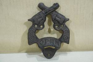 lot 66 image: Cast Iron Crossed Revolver Bottle Opener
