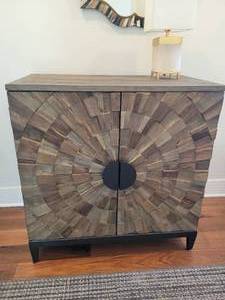 2 Door Cabinet. Segmented Sun Burst Pattern
