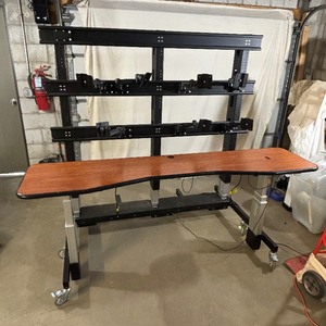 lot 2 image: MSRP $12,000 AFC Industries Mobile Power Height Adjusting Control Room Console With Video Wall Monitoring System - Back Rack Powers UpDown However Unable To Figure Out Why The Table Does Not Do The Same - Sold As Is...Still A Fantastic System