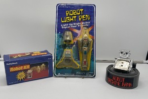 1984 Arco robot pen, Radioshack Robotkit, Everlast toys wind up bank.