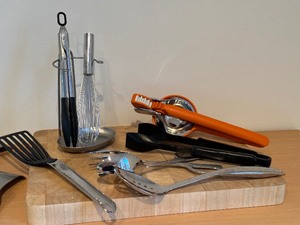 lot 74 image: Quality Kitchen Necessities including a Cutting Board and Utensils
