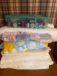 lot 127 image: White Flannel Fabric, Thread, Pinking Shears and Duck Fleece