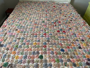lot 8 image: Appraised Handmade Yo-Yo quilt from 1935