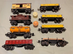 lot 286 image: Lionel Trains including Shell Tanker, Pennsylvania box car and Conversion Hitch Car