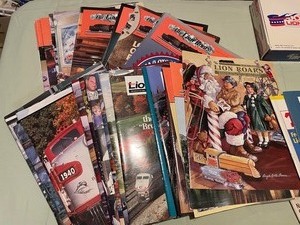lot 288 image: Train Magazines including Lions Roar, Lionel Checklist Cards, and Collector Box