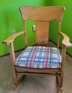 Vintage oak rocking chair with white plaid cushion