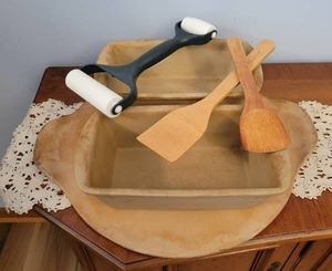 Pampered Chef pizza stone and bread pans