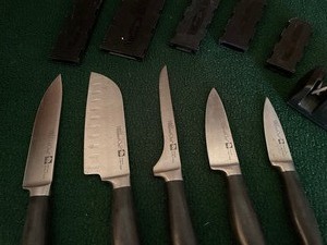 Knife Set with protective sleeves and Sharpener by Pampered Chef