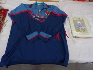 lot 64 image: Vintage Indian Wolf Shirt by Carole Durham and The Gift of the Sacred Pipe book