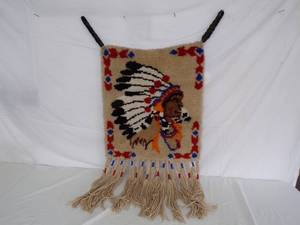 lot 112 image: Vintage Chief Rug Latch hook Wall Hanging with Braided Leather Straps