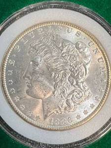 1886 US MORGAN SILVER DOLLAR IN GREEN CASE