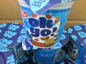 lot 379 image: Case of 12- 2.2 oz Cocoa Pebbles OK...