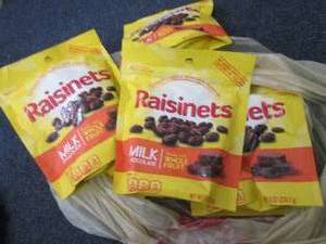 lot 449 image: 6- 8 oz Bags Raisinets in date...