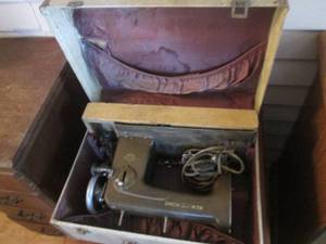 New Home Vintage Portable Sewing machine with briefcase style travel case