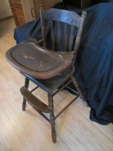 Vintage babys wooden baby highchair with a dark Vintage stain finish