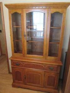 Vintage 2pc Wood Buffet style Hutch. Upper portion contains glass front doors to display your beautiful treasures while the lower portion contains a sectionalized pull out drawer and cupboard style door to conceal the not so treasures