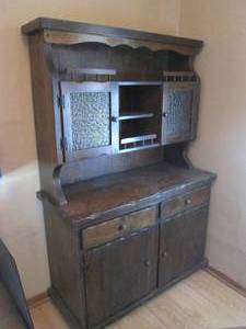 Vintage 2pc dark tone Buffet Hutch. Upper section sports depression glass front doors, open storage and decorative railings while the lower section sports two drawers as well as two cupboard style doors to hold the family silverware