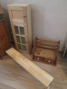 Compartmentalized narrow window frame style cabinet, long over the sink type wood plant stand as well as a unique 2-drawer almost bench style shelf