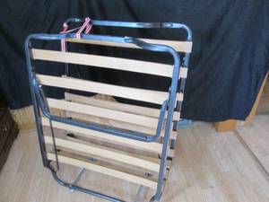 Metal framed, wood slatted Fold-up cot on wheels