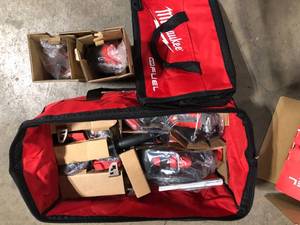 Milwaukee M18 FUEL 18V Lithium-Ion Brushless Cordless Combo Kit with Two 5.0 Ah Batteries, 1 Charger, 2 Tool Bags (7-Tool)    Customer Returns See Pictures
