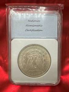 1886-O Morgan Silver Dollar (graded AU55)