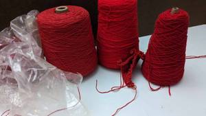 lot 28 image: Three Skeins Of Red Acrylic  Nylon Yarn