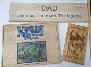 lot 54 image: Three Wooden Engraved Wall Hangings