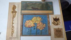 lot 57 image: Four Wood Engraved Epoxy Wall Hangings