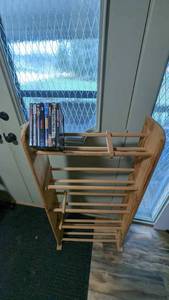 lot 68 image: DVDs And Wooden Stand To Store Them On