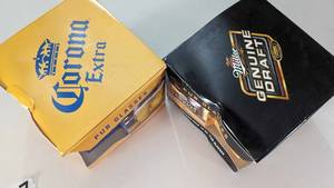 lot 117 image: Corona Extra Four 16 OZ Pub Glasses-Miller Genuine Draft Four 16 OZ Pub Glasses--Licensed Products