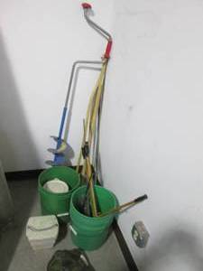 lot 10 image: Corner with hand auger, wood walking aids and 5-gallon buckets of fun