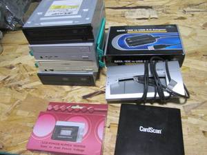 lot 18 image: Stack of misc hard drives with power supply tester