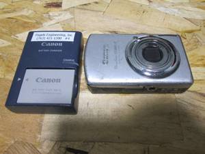 lot 21 image: Canon Powwrshot SS880IS digital camera with battery and charger