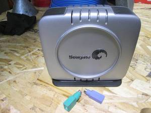 lot 23 image: Seagate external hard drive with power cord