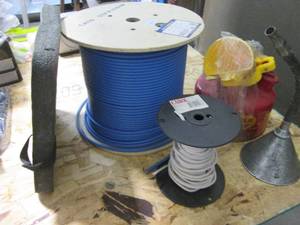 lot 25 image: Near full 1000ft roll of 23AWG-4 STP Pure copper coated wire, metal gas can and more