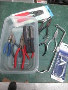 lot 58 image: Lot of assorted needle nose pliers, crimping tool, extraction tool and flashlights